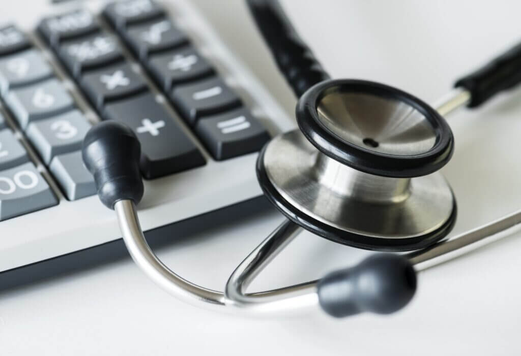 stethoscope resting on a computer keyboard