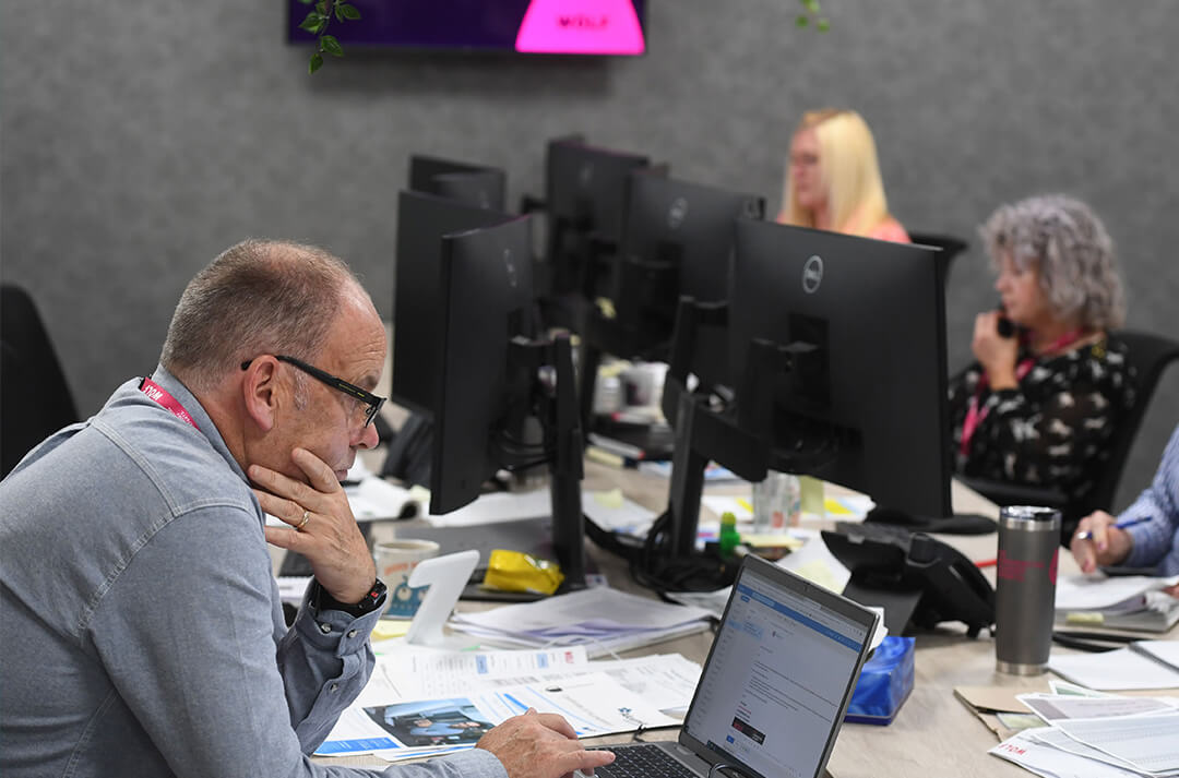 Wolf employees working.