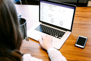 A lady viewing serviceMaster on her laptop.